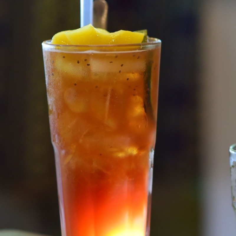 Iced tea with fruit, shaken over ice