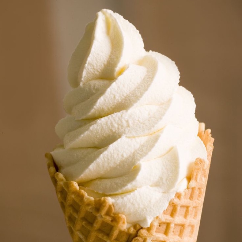A vanilla soft-serve cone